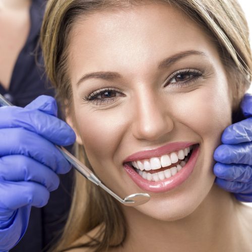 Teeth checkup at dentist, smiling woman with white teeth